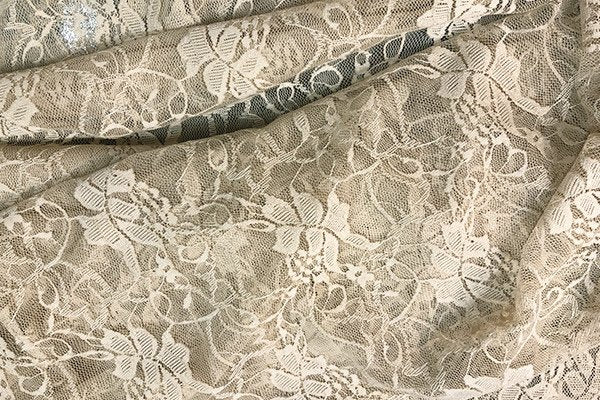Tessuto in pizzo beige