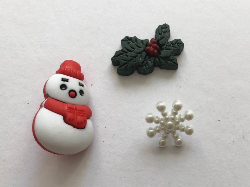 Bottoni natalizi pupazzo e fiocchi di neve