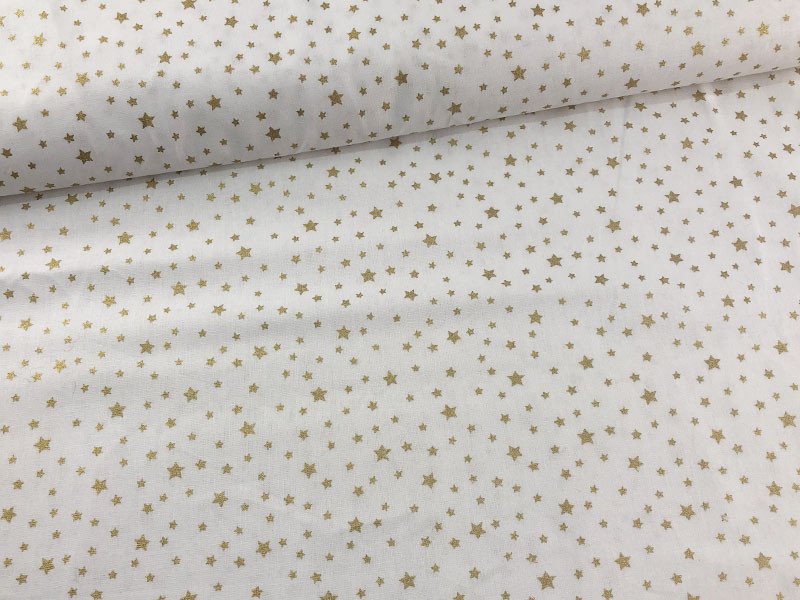 Tessuto in cotone con stelle oro