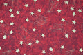 Tessuto Natalizio rosso con stelle oro